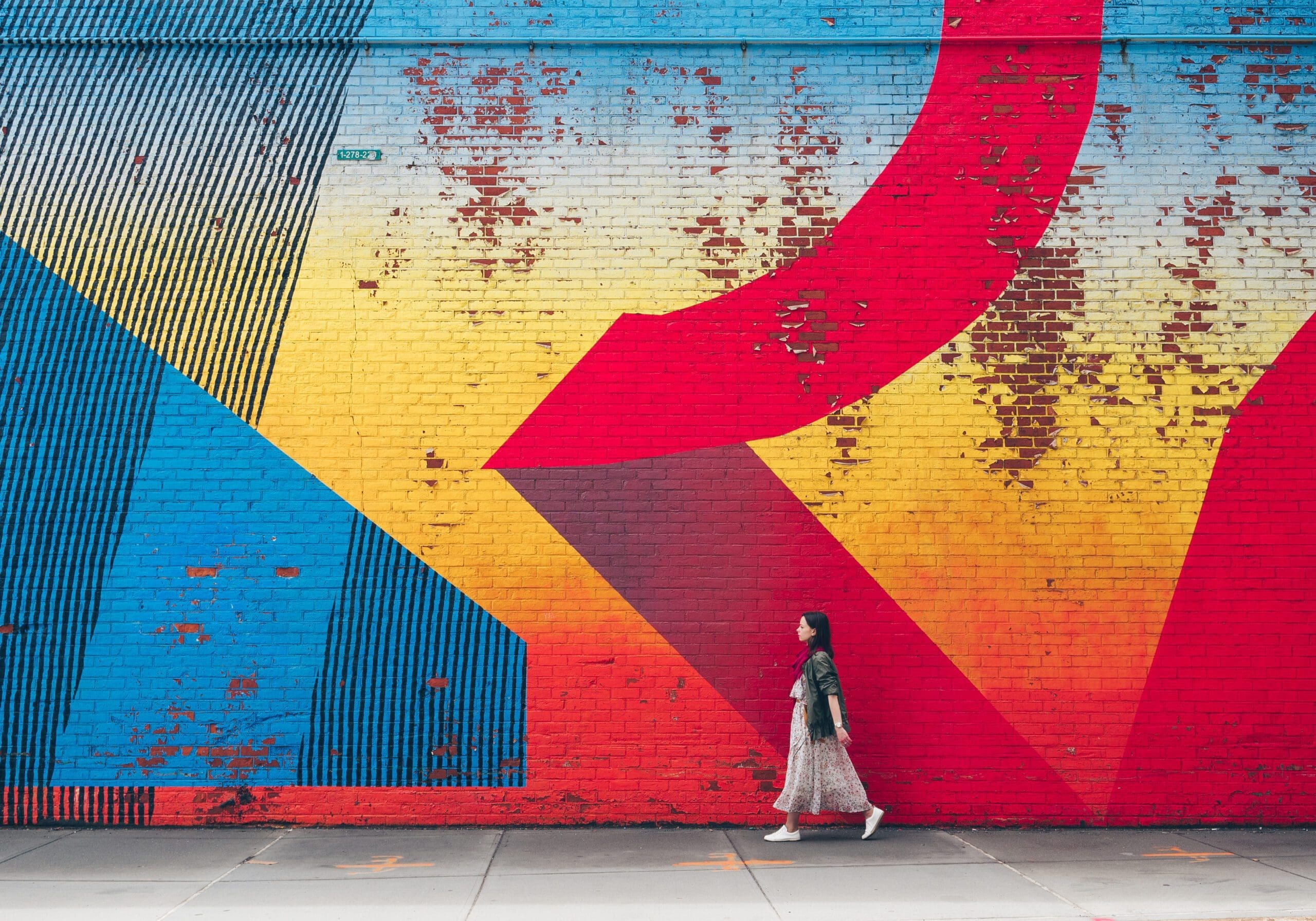 Young girl on the background of graffiti